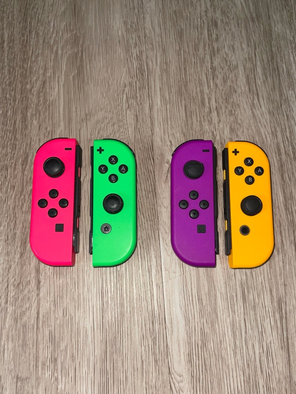 Nintendo Switch Joy Con Pair Neon Pink/Green, Purple/Orange Controller Bundle